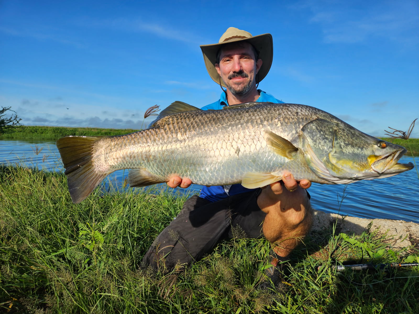 Man with Barramundi fish from Barramundi tour